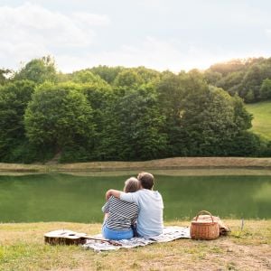 senior-couple-at-the-lake-having-a-picnic-2022-02-02-05-05-18-utc
